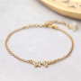 Boucles d&rsquo;oreilles et bracelets tendance avec des breloques et des connecteurs en zirconium :
