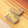 D&eacute;couvrez comment combiner vos boucles d&rsquo;oreilles DQ branch&eacute;es avec des breloques 