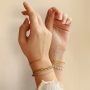 Associez colliers et bracelets en acier inoxydable