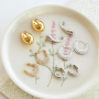 Inspiration bijou avec des boucles d'oreilles en acier inoxydable
